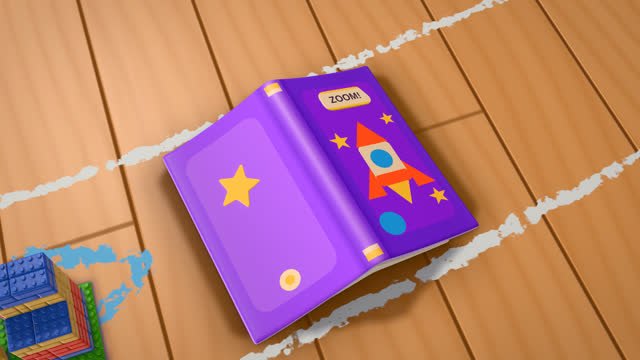 An open picture book lying across the edge of the track